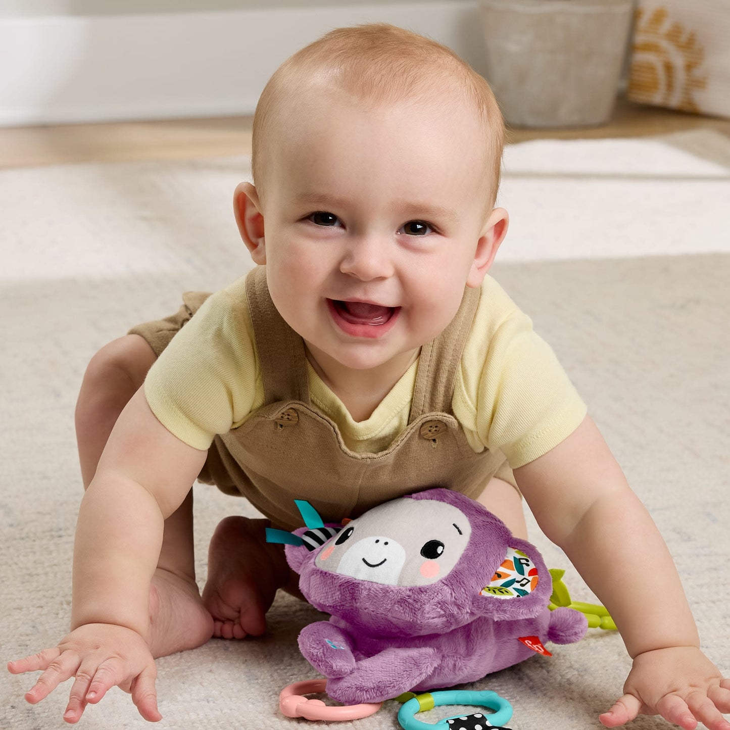 Fisher-Price Sing & Go Purple Monkey Plush Baby Stroller Sensory Toy for Newborns